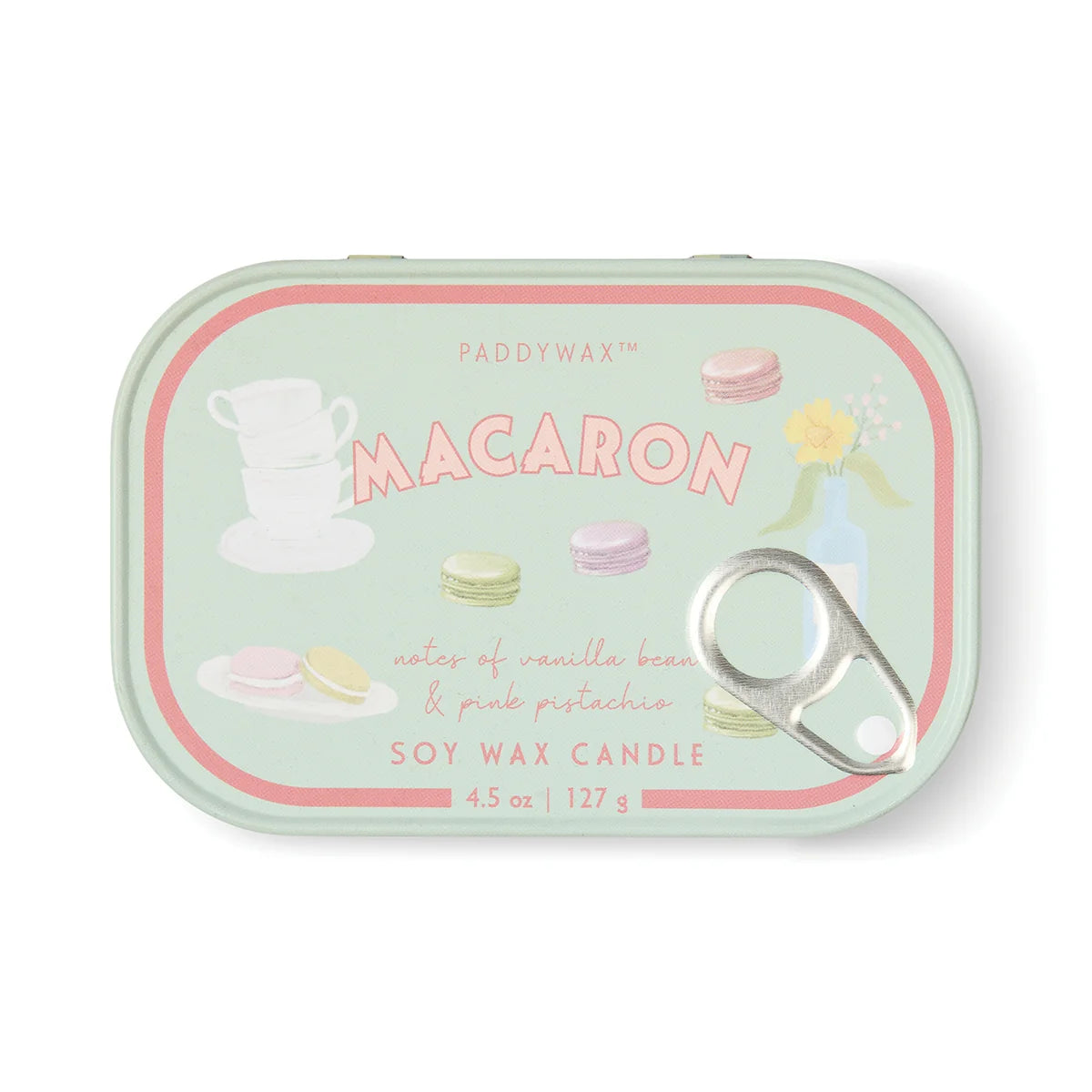 Paddywax Macaron candle tin with colorful macaron illustrations on a white background