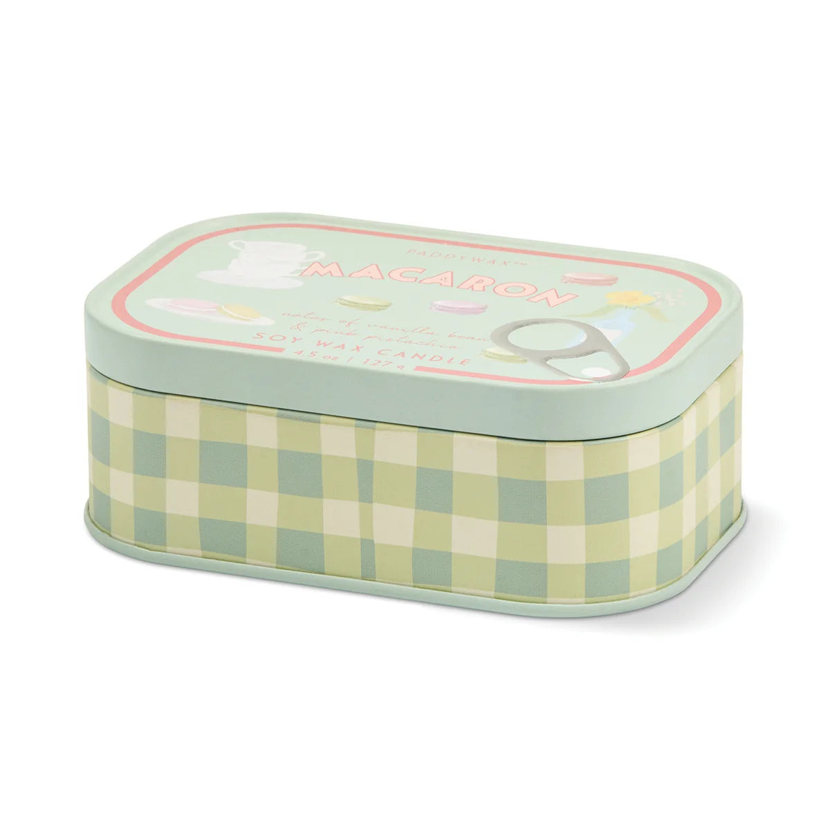 A rectangular metal tin candle with a pastel green and cream gingham patterned body and a mint green lid. The lid features a decorative label with the word 'MACARON' in pink and illustrations of a macaron and a whisk.