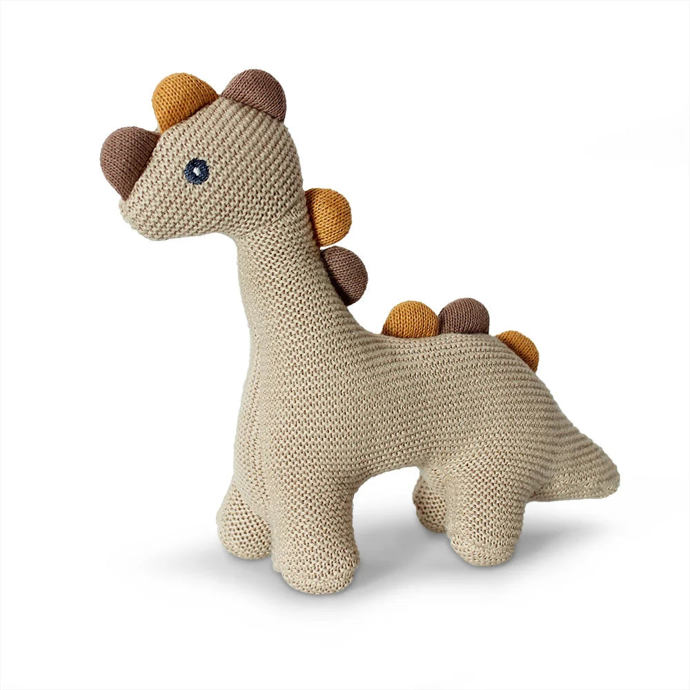 Knitted dinosaur baby rattle toy in linen colour