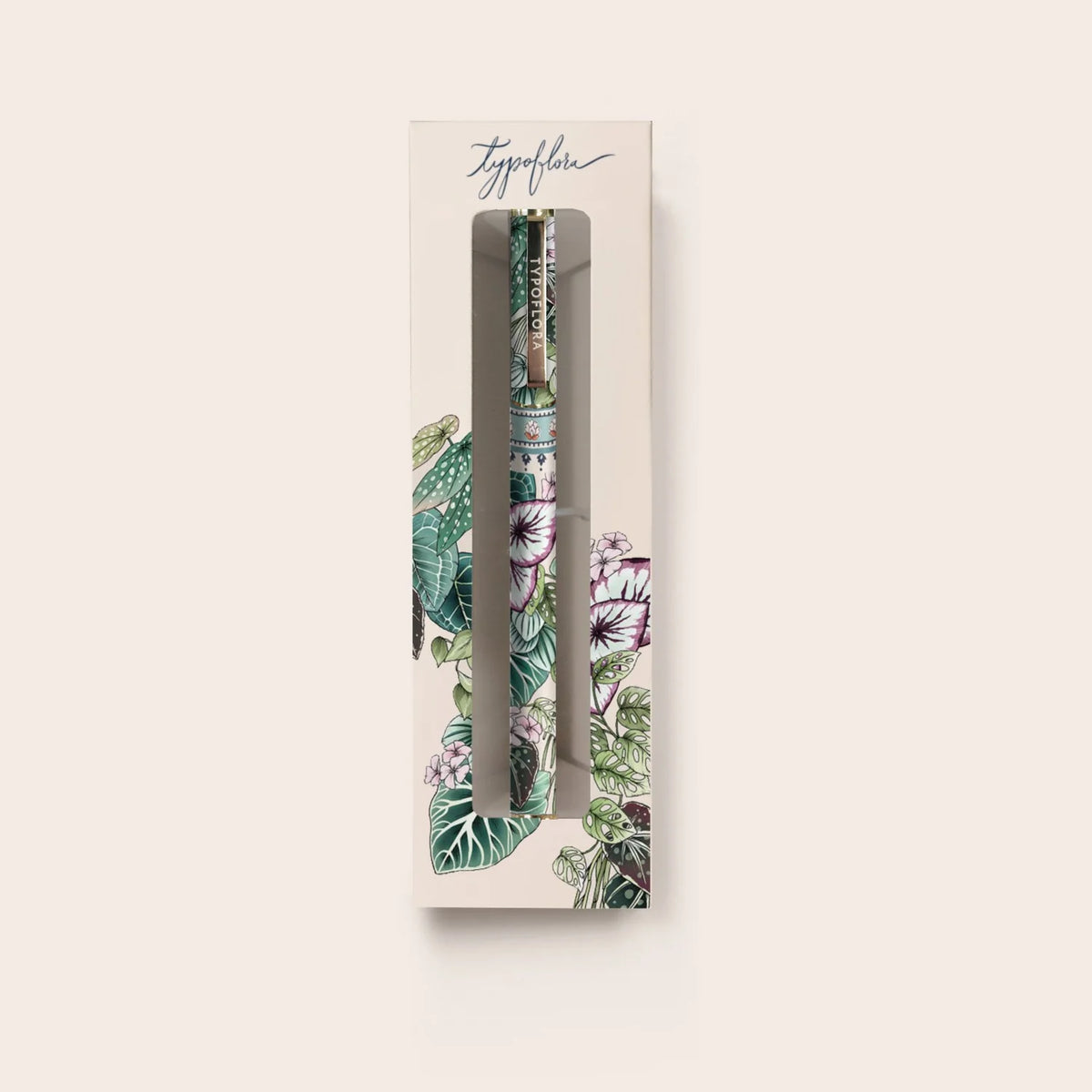 Floral-patterned pen in a decorative box on a light beige background