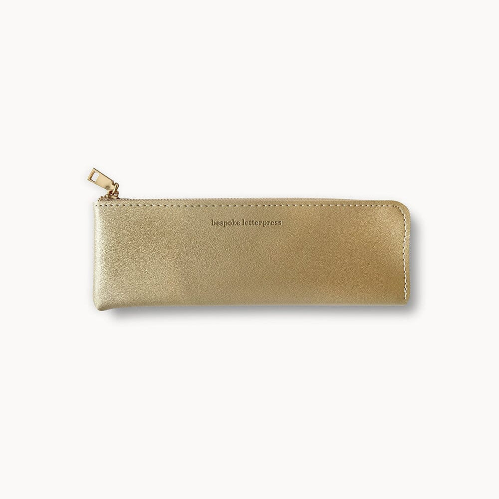 Gold pencil case with a brand name on a white background