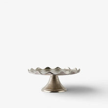 Decorative metal  cake stand on a white background