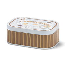 A rectangular metal tin candle with a brown and beige vertical wood-grain patterned body, a white lid, and a colorful label reading 'CAPPUCCINO' with coffee-themed illustrations.
