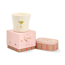 Candle in a decorative box with a pink and green striped design on a white background