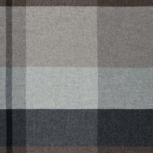 Plaid blanket with gray, brown, and grey colors on a white background