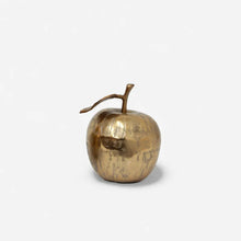 Decorative apple ornament in champagne colour on white background