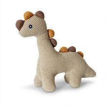 Knitted dinosaur baby rattle toy in linen colour
