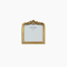 Decorative gold picture frame on a white background
