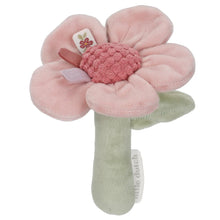 Pink flower-shaped rattle with a green handle on a white background