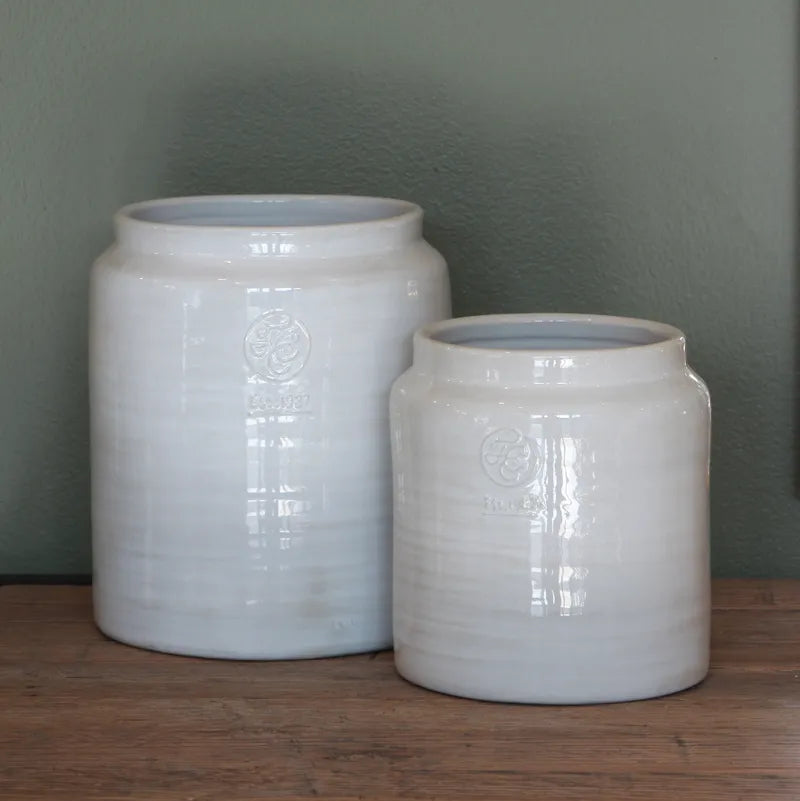 Two white ceramic utensil holders