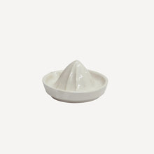 White ceramic lemon squeezer on white background