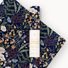 Floral-patterned paper with a white product packaging on a white background