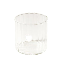 Clear drink glass with white heart