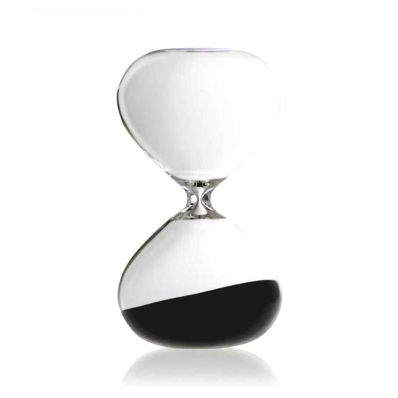 Hourglass with black sand on a white background