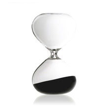 Hourglass with black sand on a white background