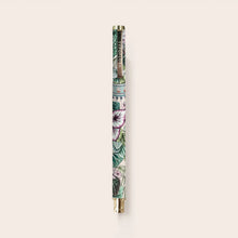 Pen with floral design on a light beige background