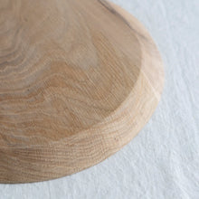 Wooden cutting board on a white surface