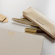  Gold pencil case, pens, ruler an diary