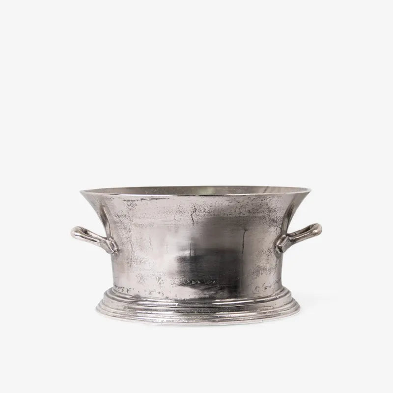Silver metal champagne bucket with handles on a white background