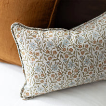 floral lumbar cushion and amber plain cushion