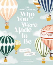 A cover illustration of the book 'The World Needs Who You Were Made to Be' by Joanna Gaines, featuring colorful hot-air balloons with children inside, against a blue sky background.