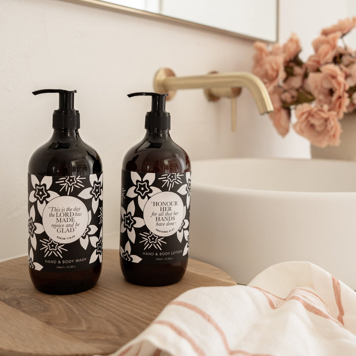 Well Versed Homes Signature Wash and Lotion sitting on wooden board with sink