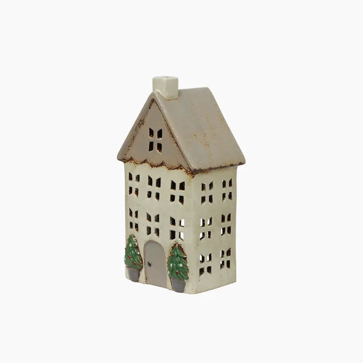 A small ceramic house shaped tealight holder
