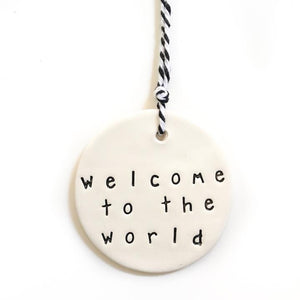 Handmade ceramic tag Welcome to the world
